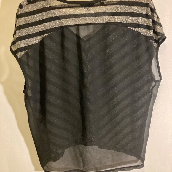 Be glam in this ultra light Guess sheer chevron gold and black top. - Picture 2 of 2